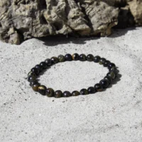 falkeøje armbånd i skinnende blå og brune nuancer