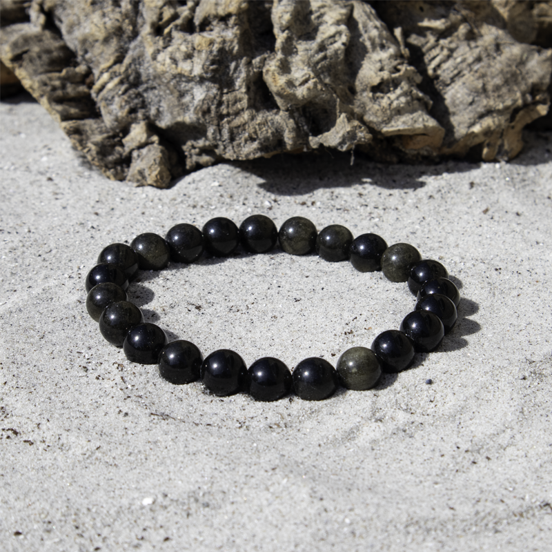 guld obsidian 8 mm armbånd i sort nuance med guld skær.