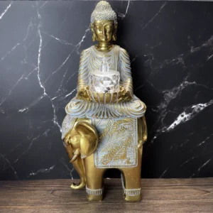 buddha på elefant fyrfadsholder statue i guld nuancer